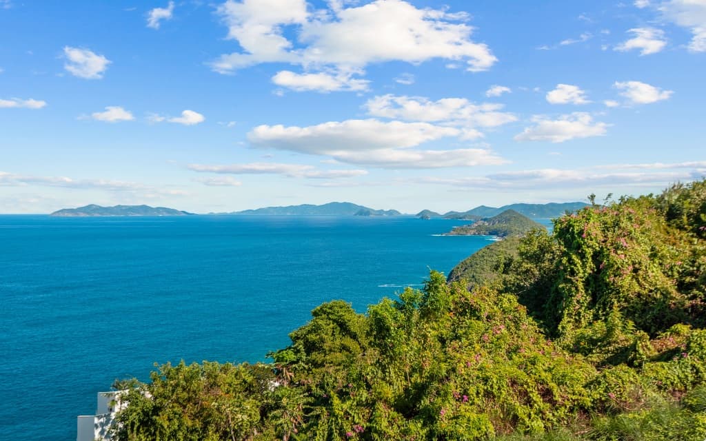 Sweeping blue Atlantic horizon from Mahogany Run hillside