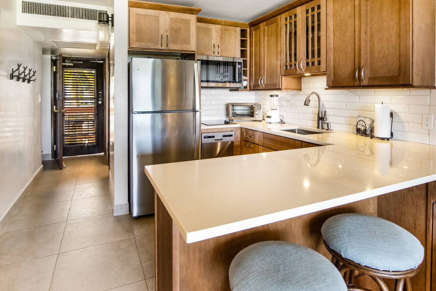 Modern kitchen with a cooktop and dishwasher, along with three coffee options! Keurig, drip, or Nespresso.