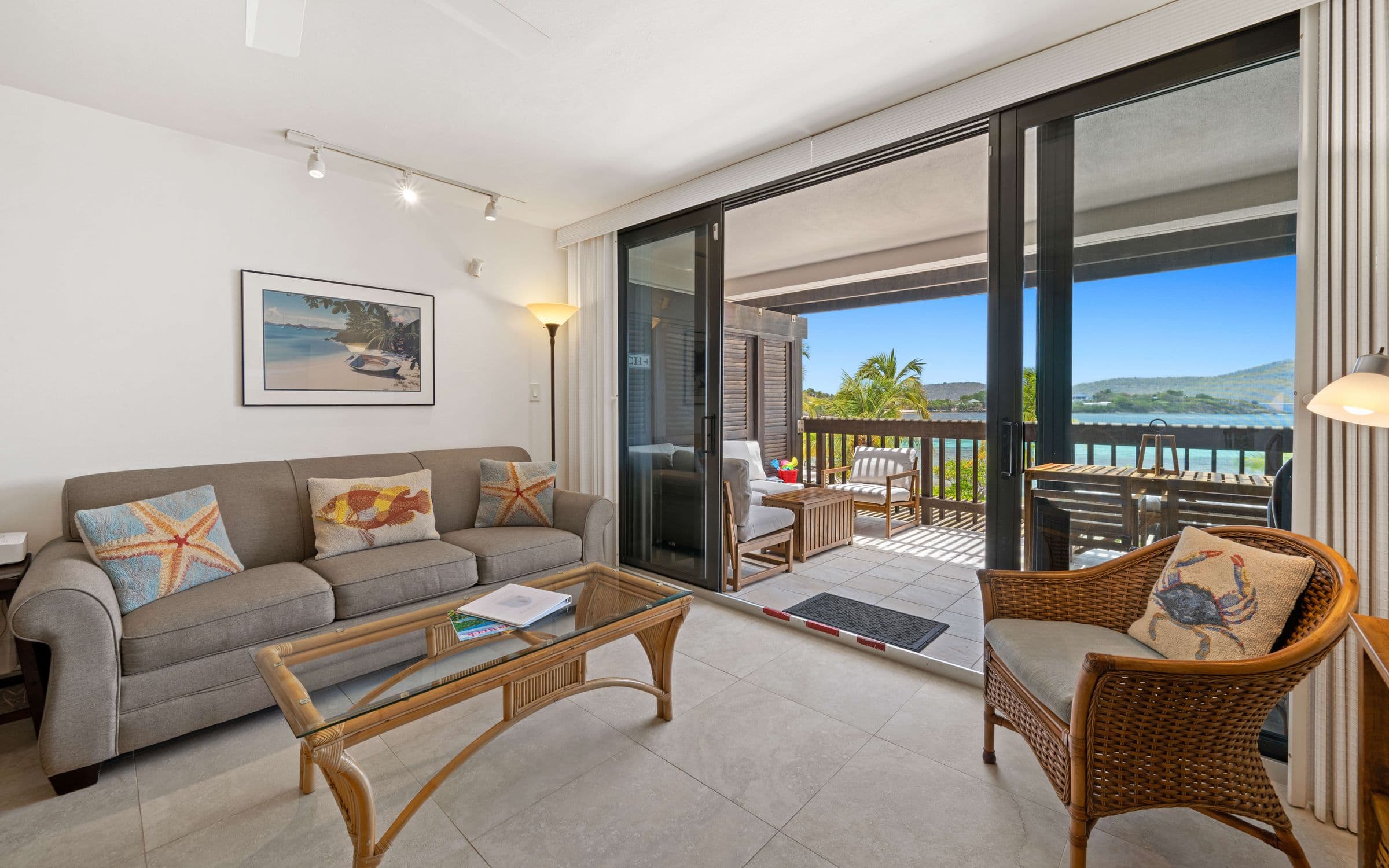 Sapphire Beach villa living room opening to a turquoise bay