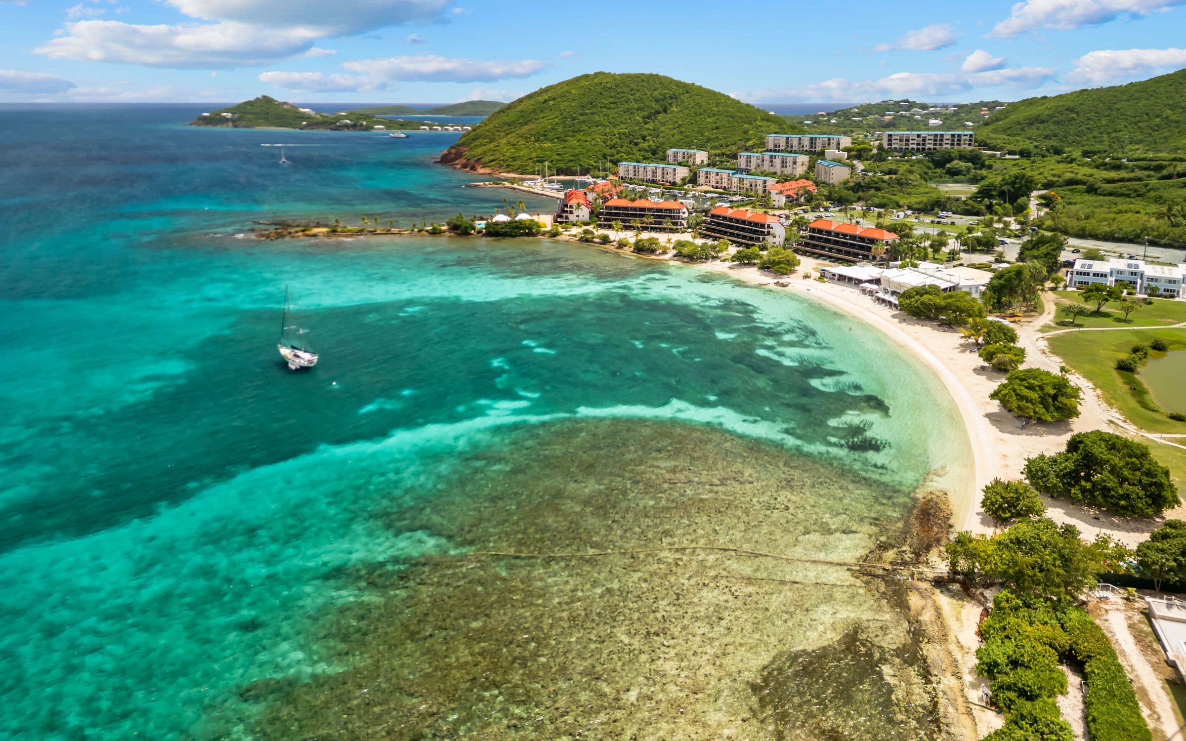 Aerial view of Sapphire Bay and the resort beach