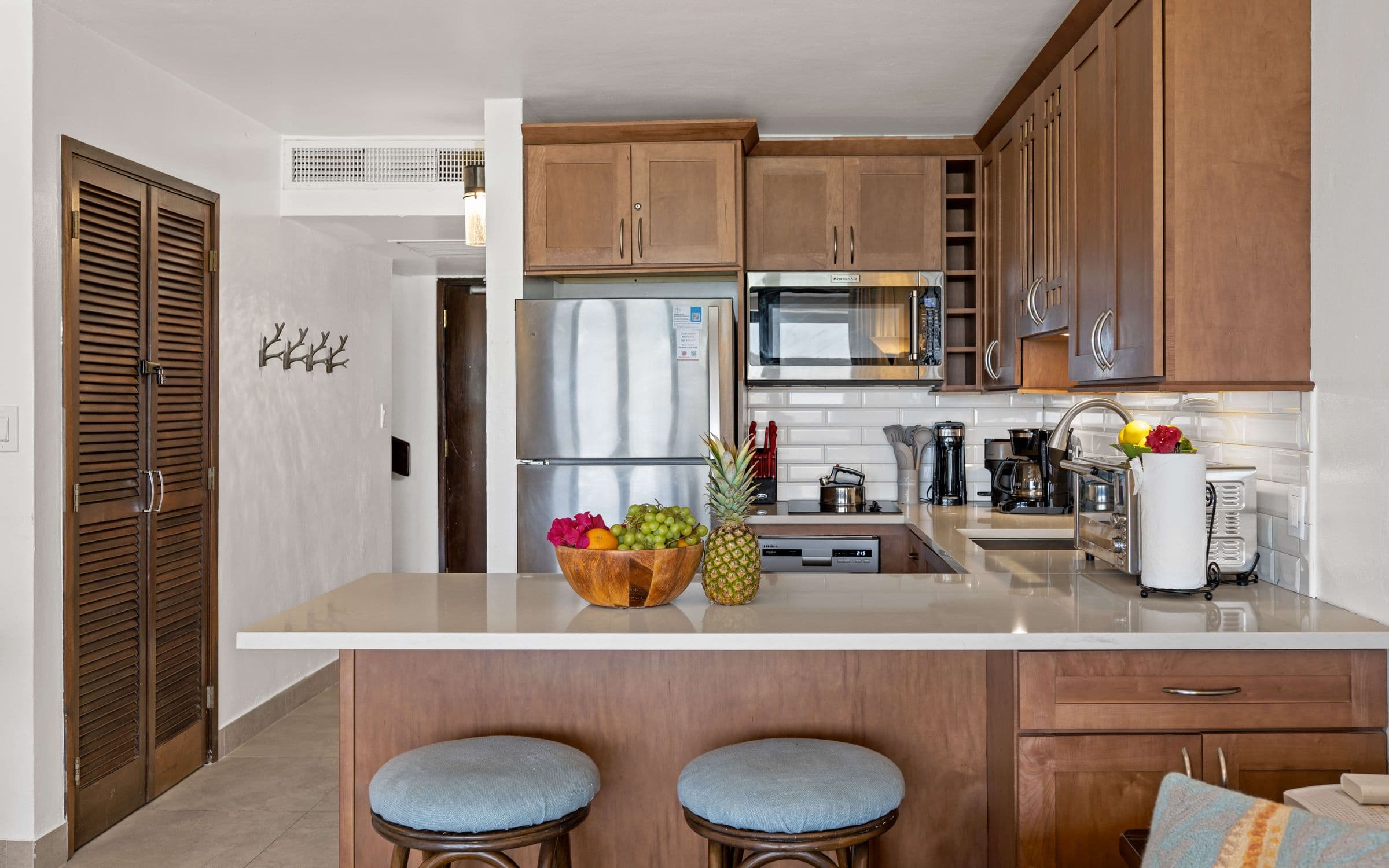 Modern kitchen with a cooktop and dishwasher, along with three coffee options! Keurig, drip, or Nespresso.